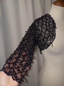 Coprispalle in paillettes.
